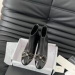 Chanel bow boots