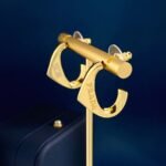 PRADA C-shaped triangular logo earrings